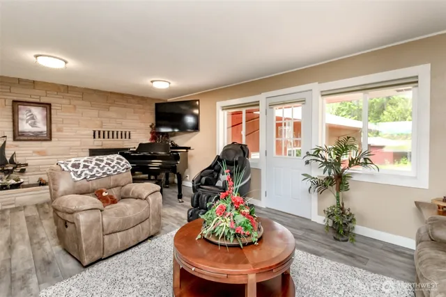 a living room with furniture and a large window