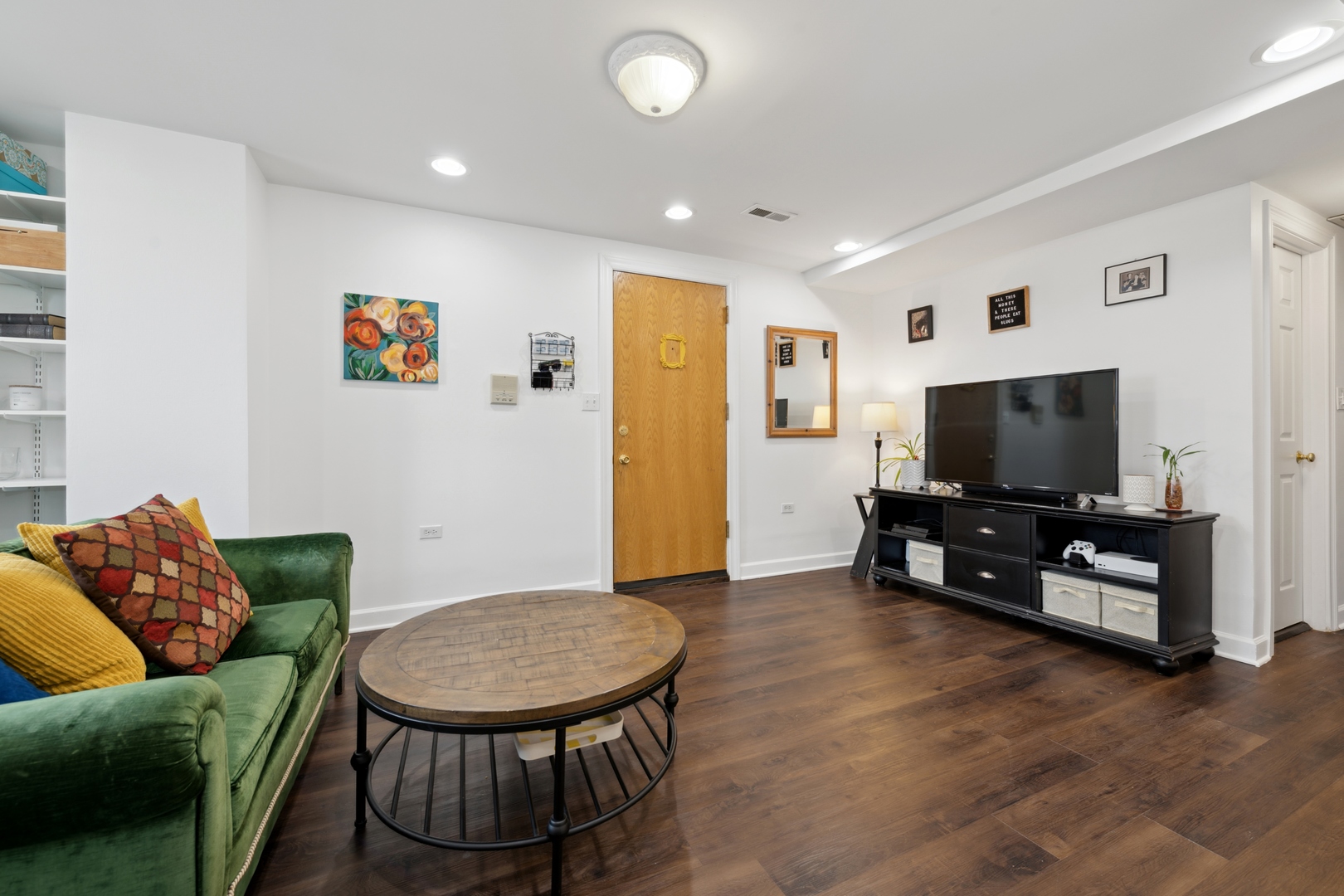 3845 West Altgeld Street, Unit G Chicago, IL 60647 - Photo 2 of 15 a living room with furniture and a flat screen tv