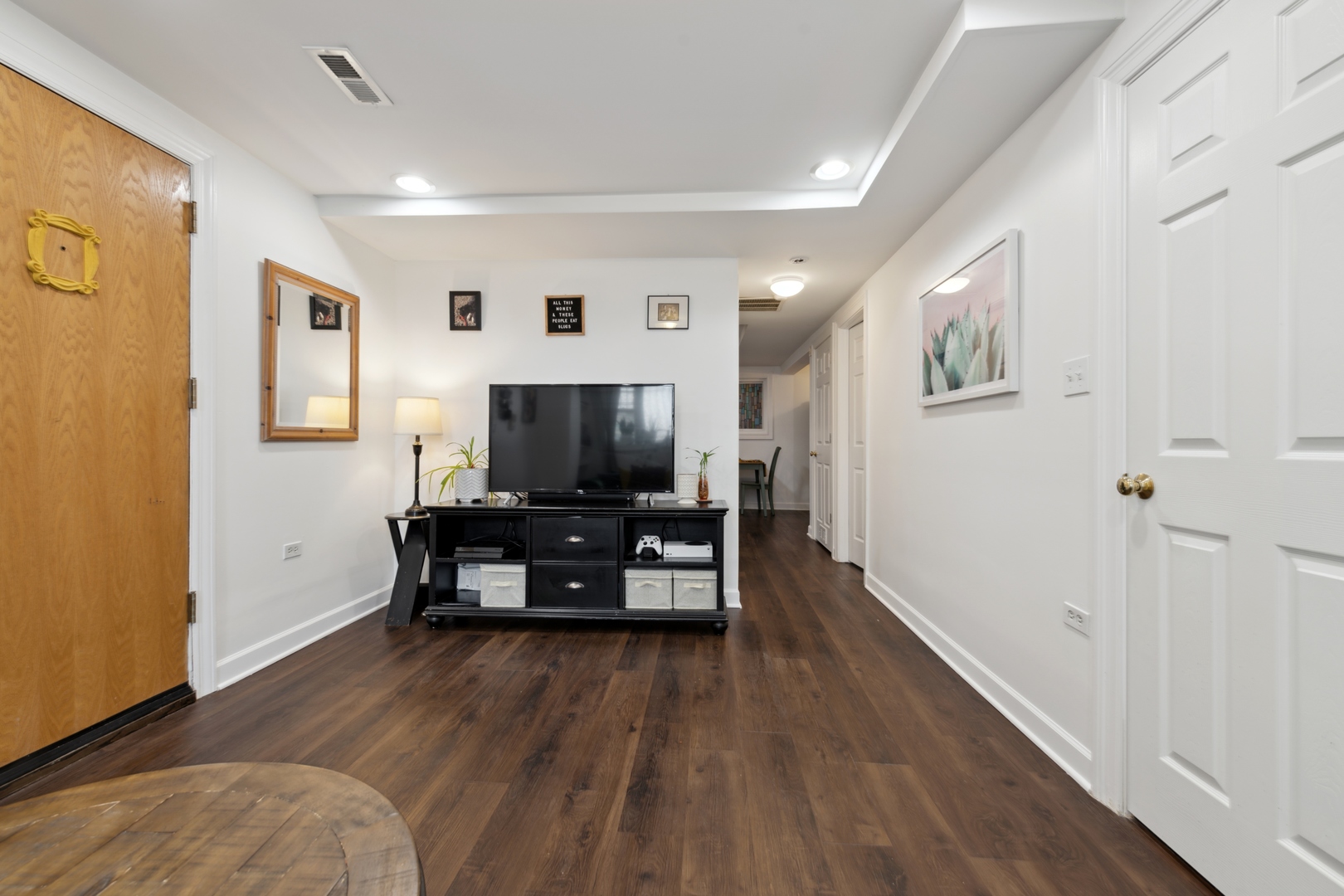 3845 West Altgeld Street, Unit G Chicago, IL 60647 - Photo 4 of 15 a living room with furniture and a flat screen tv
