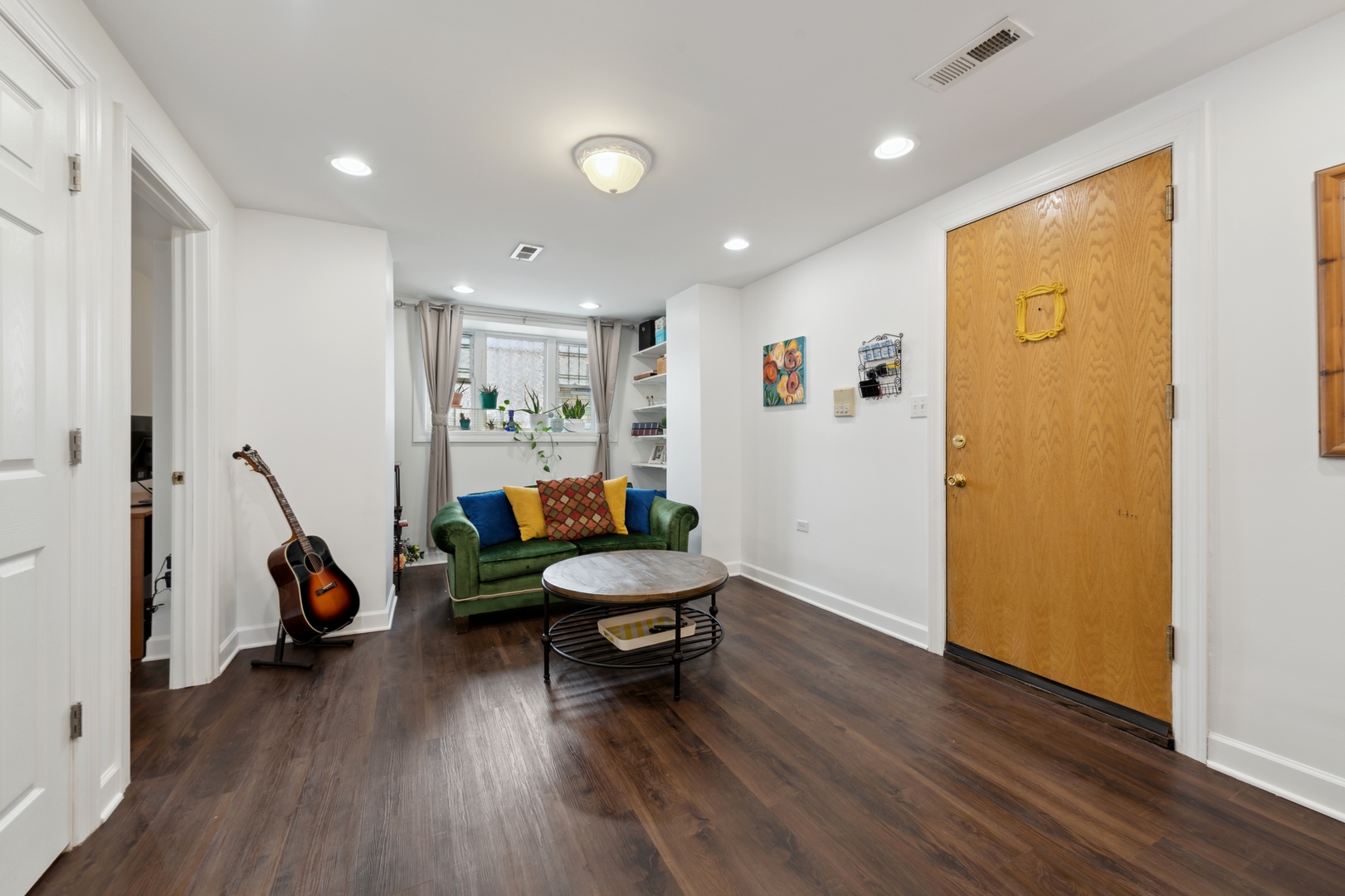 3845 West Altgeld Street, Unit G Chicago, IL 60647 - Photo 5 of 15 a living room with furniture and a wooden floor