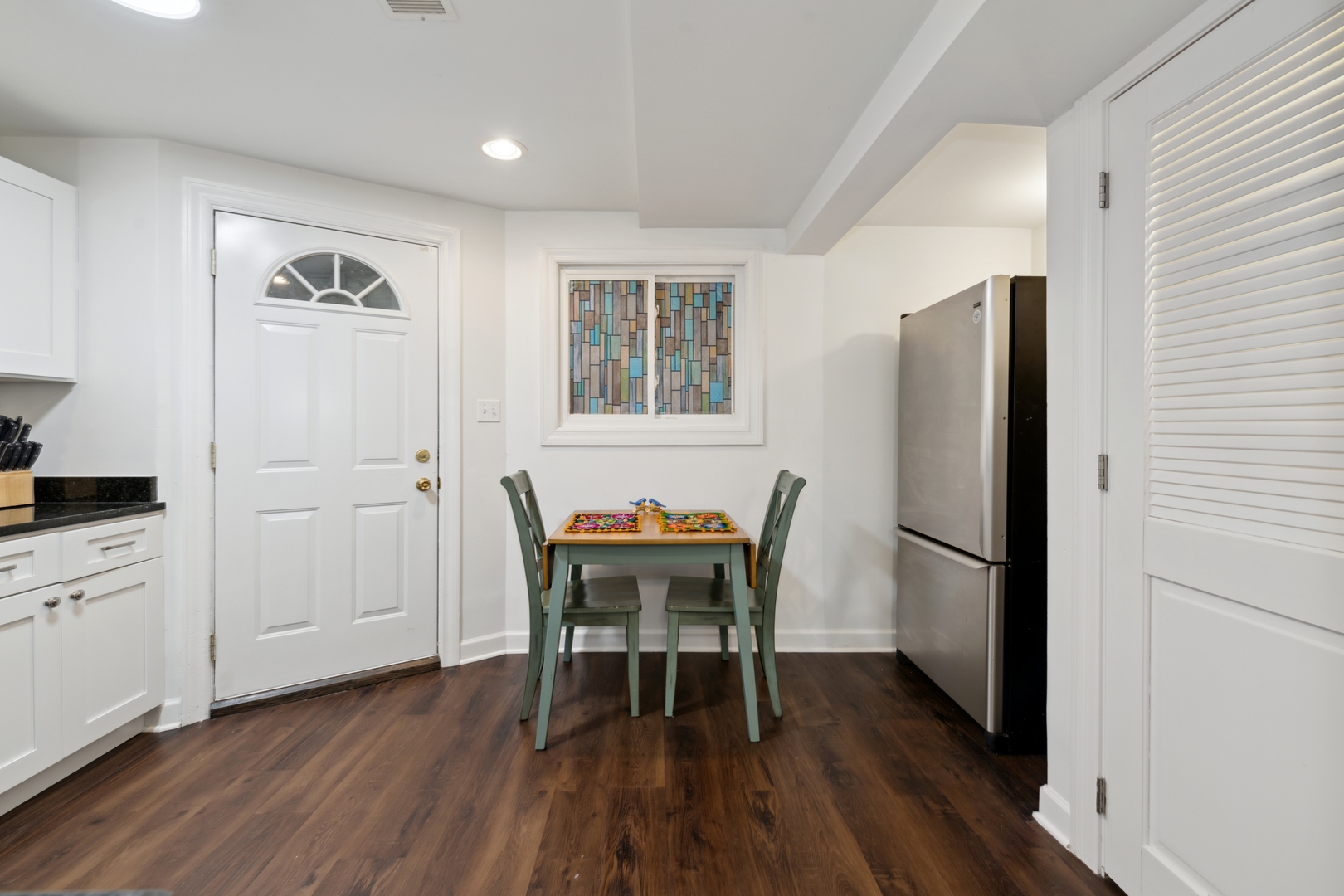 3845 West Altgeld Street, Unit G Chicago, IL 60647 - Photo 7 of 15 a dining room with furniture and wooden floor