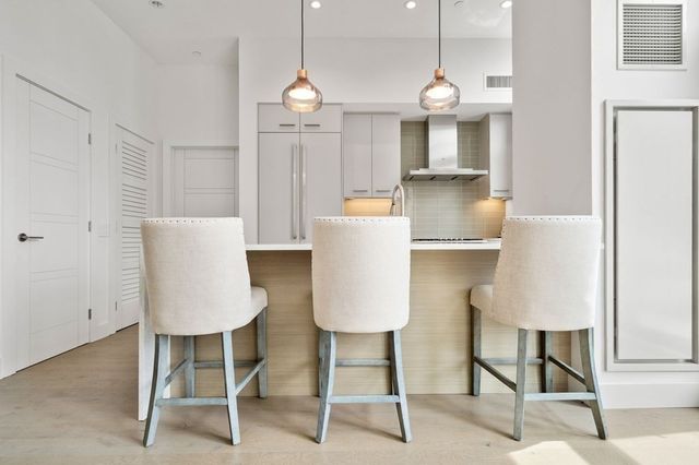 a view of kitchen with table and chair