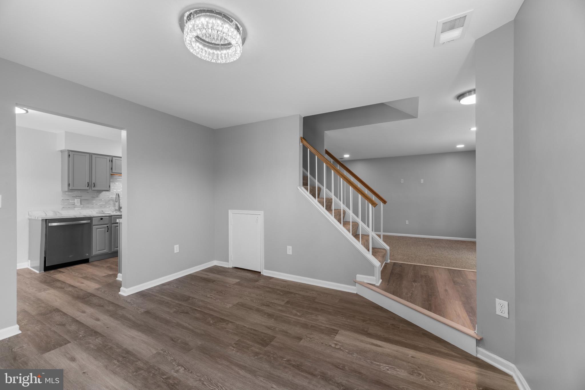 9302 Player Drive, Unit 155 Laurel, MD 20708 - Photo 10 of 43 a view of entryway and hall with wooden floor