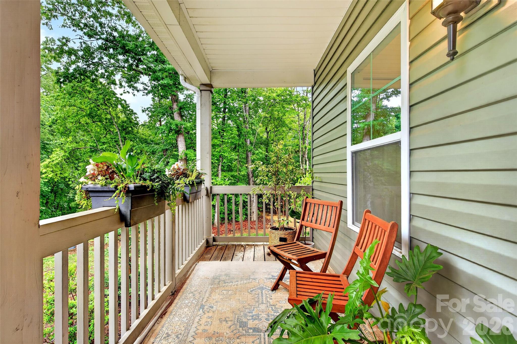 132 Maple Ridge Drive Old Fort, NC 28762 - Photo 6 of 40 a porch with a bench