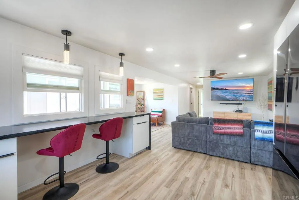 699 North Vulcan Avenue, Unit 6 Encinitas, CA 92024 - Photo 14 of 27 a living room with furniture and wooden floor