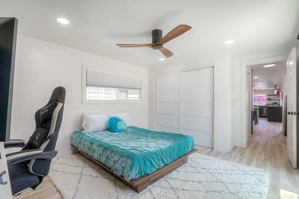 699 North Vulcan Avenue, Unit 6 Encinitas, CA 92024 - Photo 16 of 27 a bedroom with a bed and a window
