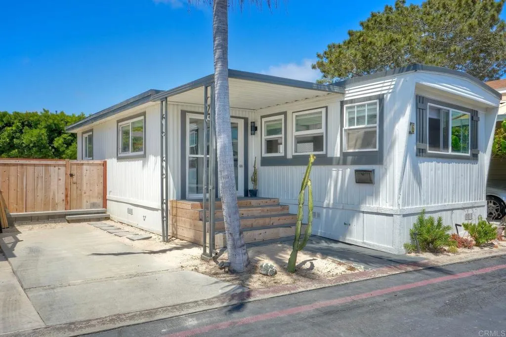 699 North Vulcan Avenue, Unit 6 Encinitas, CA 92024 - Photo 2 of 27 a front view of a house with a yard