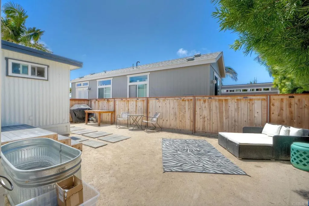 699 North Vulcan Avenue, Unit 6 Encinitas, CA 92024 - Photo 21 of 27 a backyard of a house with fire pit and furniture