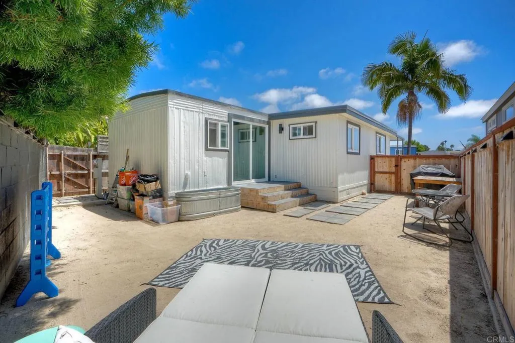 699 North Vulcan Avenue, Unit 6 Encinitas, CA 92024 - Photo 23 of 27 a view of a house with backyard and sitting area