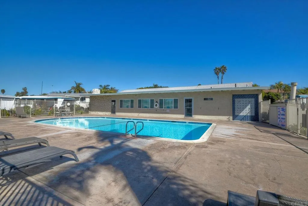 699 North Vulcan Avenue, Unit 6 Encinitas, CA 92024 - Photo 26 of 27 a front view of a house with a yard
