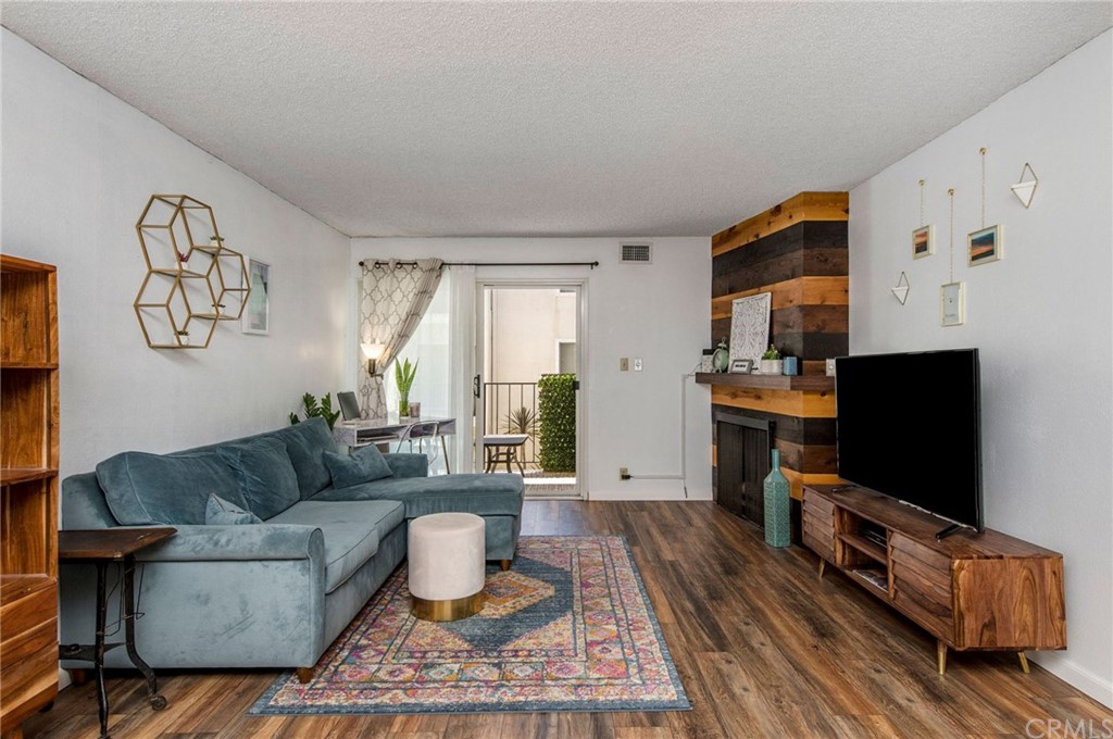 8163 Redlands Street, Unit 44 Playa del Rey, CA 90293 - Photo 1 of 1 a living room with furniture and a flat screen tv