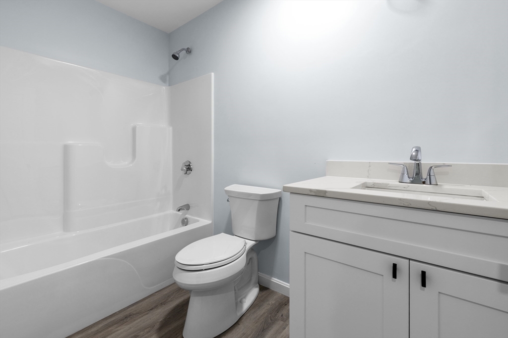 75 Hunter Street Fall River, MA 02721 - Photo 10 of 14 a bathroom with a sink a toilet and shower