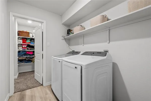 a utility room with washer and dryer