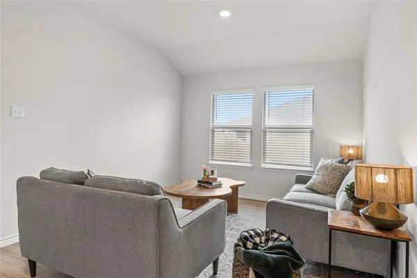 a living room with furniture and a window