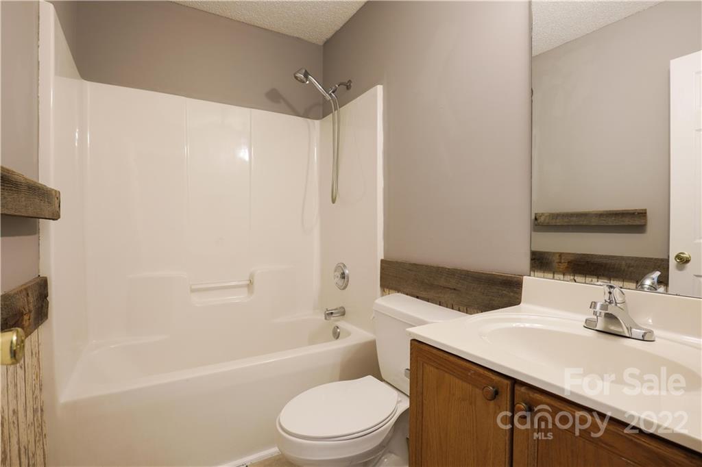 1259 Spring View Court Rock Hill, SC 29732 - Photo 11 of 13 a bathroom with a granite countertop sink toilet and shower