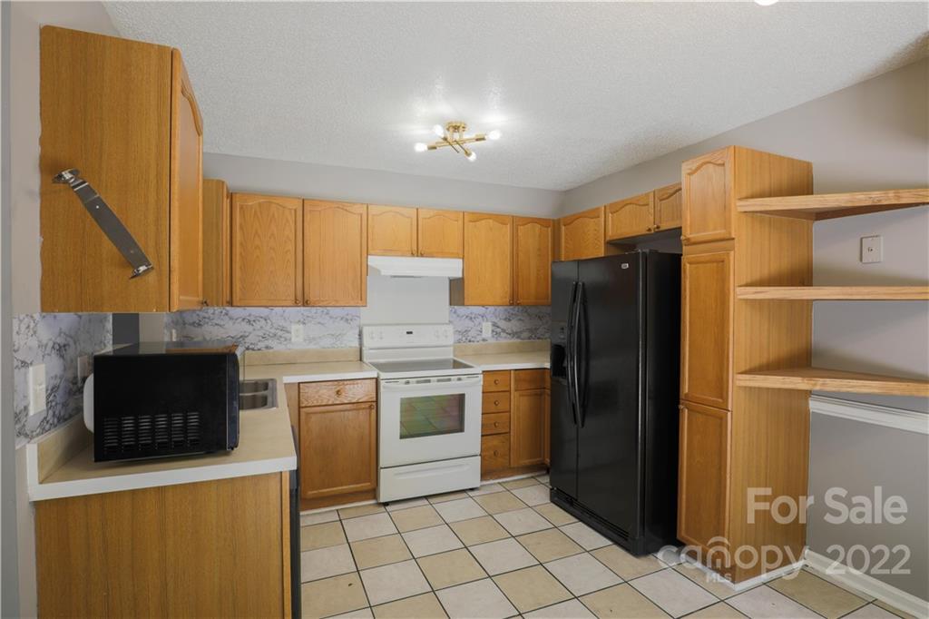 1259 Spring View Court Rock Hill, SC 29732 - Photo 2 of 13 a kitchen with stainless steel appliances a stove a refrigerator and a sink