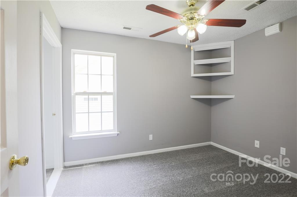 1259 Spring View Court Rock Hill, SC 29732 - Photo 5 of 13 an empty room with windows and fan