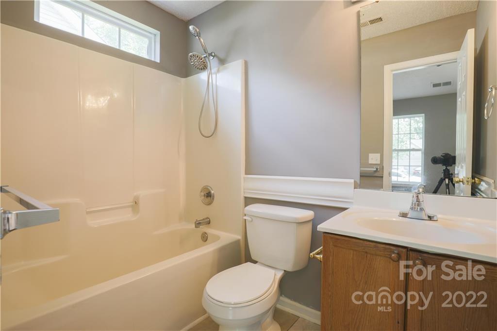 1259 Spring View Court Rock Hill, SC 29732 - Photo 10 of 13 a bathroom with a sink a toilet and a bathtub