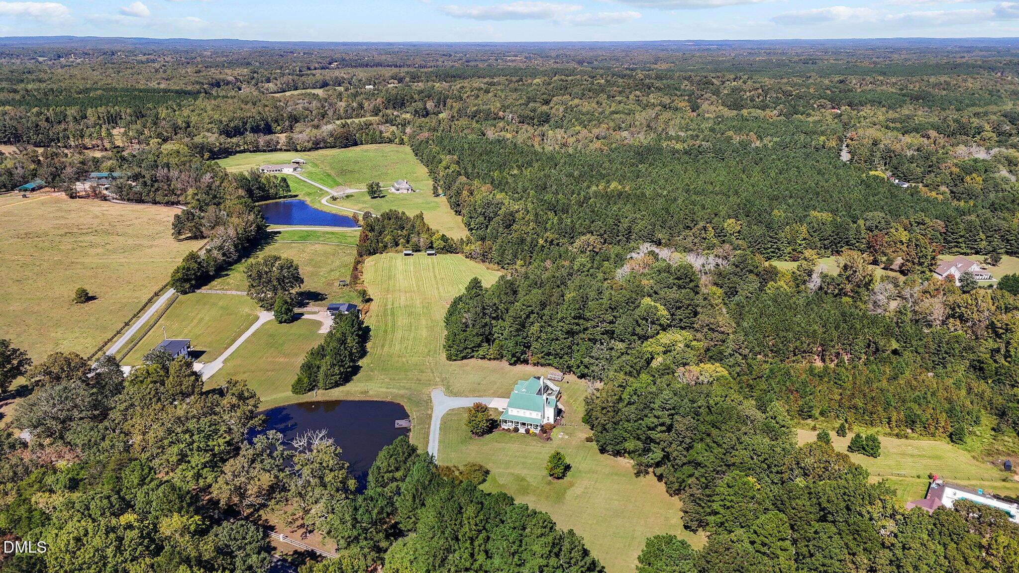 220 Epps Clark Road Siler City, NC 27344 - Photo 11 of 55 an aerial view of a house with a yard and lake view