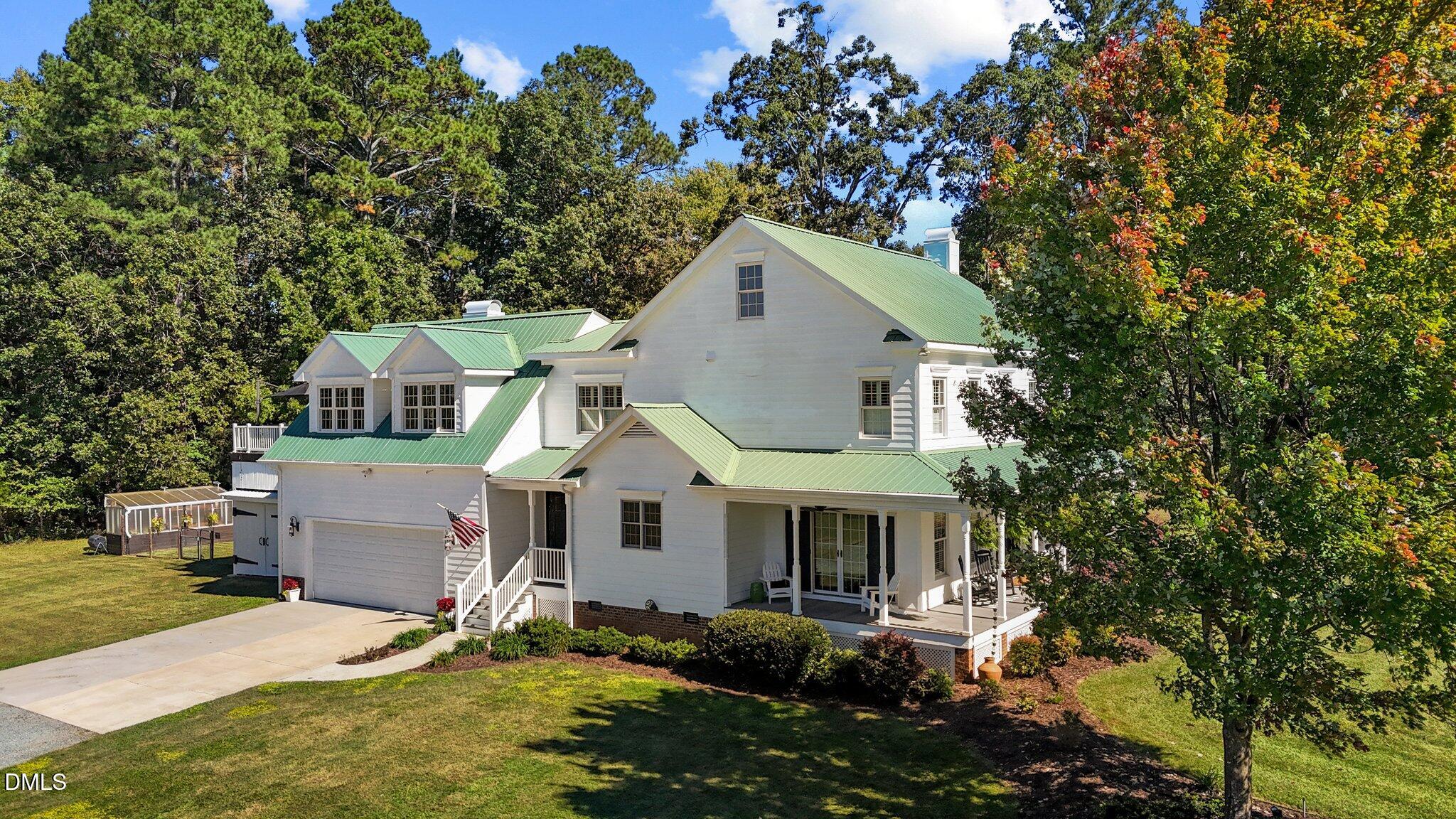 220 Epps Clark Road Siler City, NC 27344 - Photo 23 of 55 a front view of a house with a garden