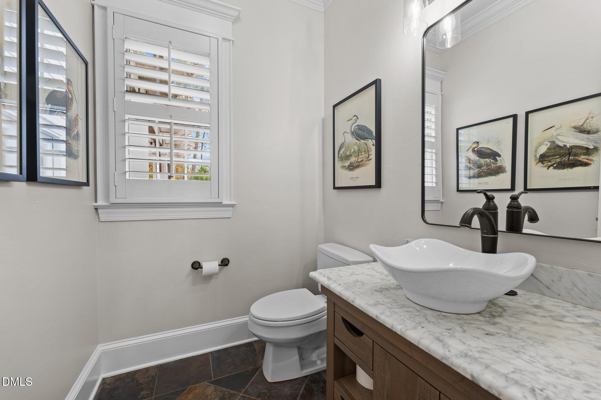 220 Epps Clark Road Siler City, NC 27344 - Photo 26 of 55 a bathroom with a granite countertop toilet sink and mirror