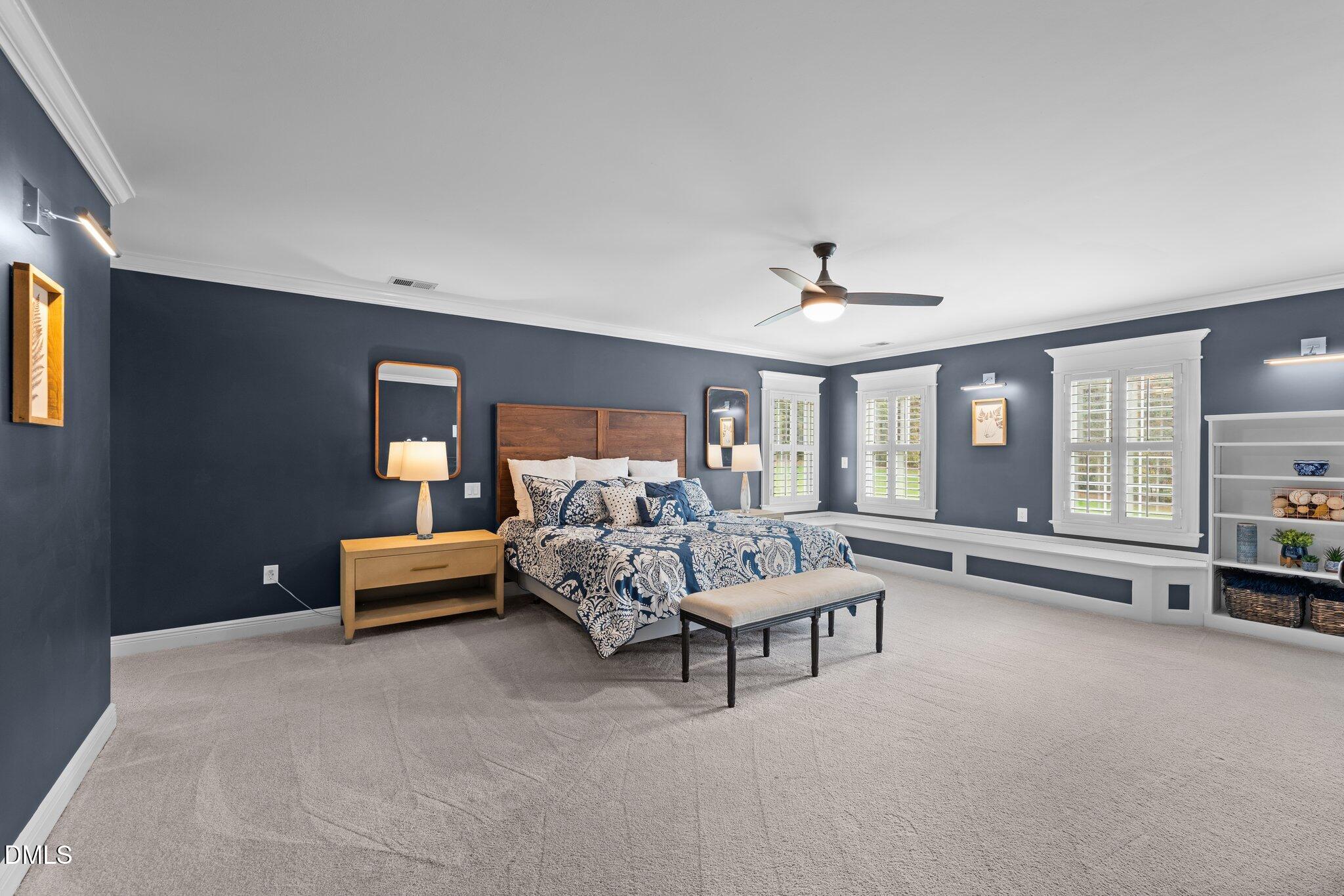 220 Epps Clark Road Siler City, NC 27344 - Photo 38 of 55 a bed room with furniture and a chandelier