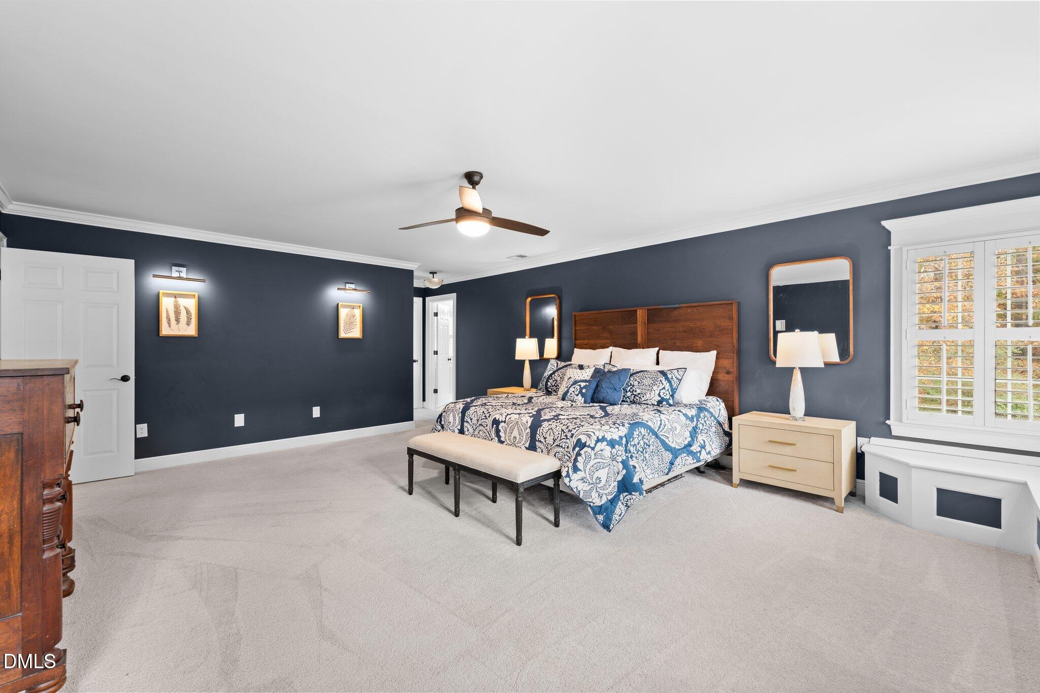 220 Epps Clark Road Siler City, NC 27344 - Photo 39 of 55 a spacious bedroom with a bed and ceiling fan
