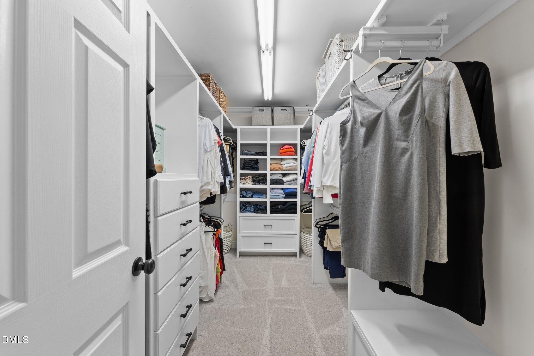 220 Epps Clark Road Siler City, NC 27344 - Photo 40 of 55 a view of walk in closet with clothes and shoes