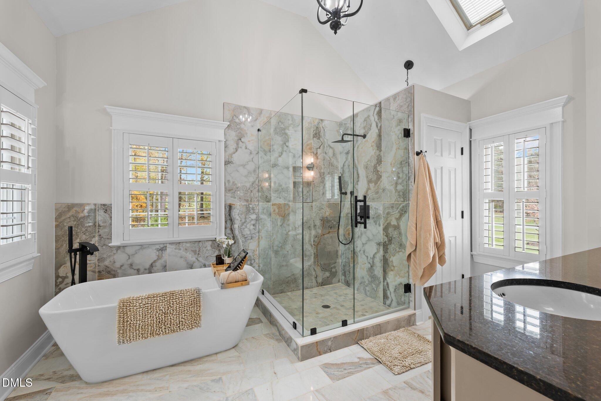 220 Epps Clark Road Siler City, NC 27344 - Photo 41 of 55 a bath room with a bath tub and a shower