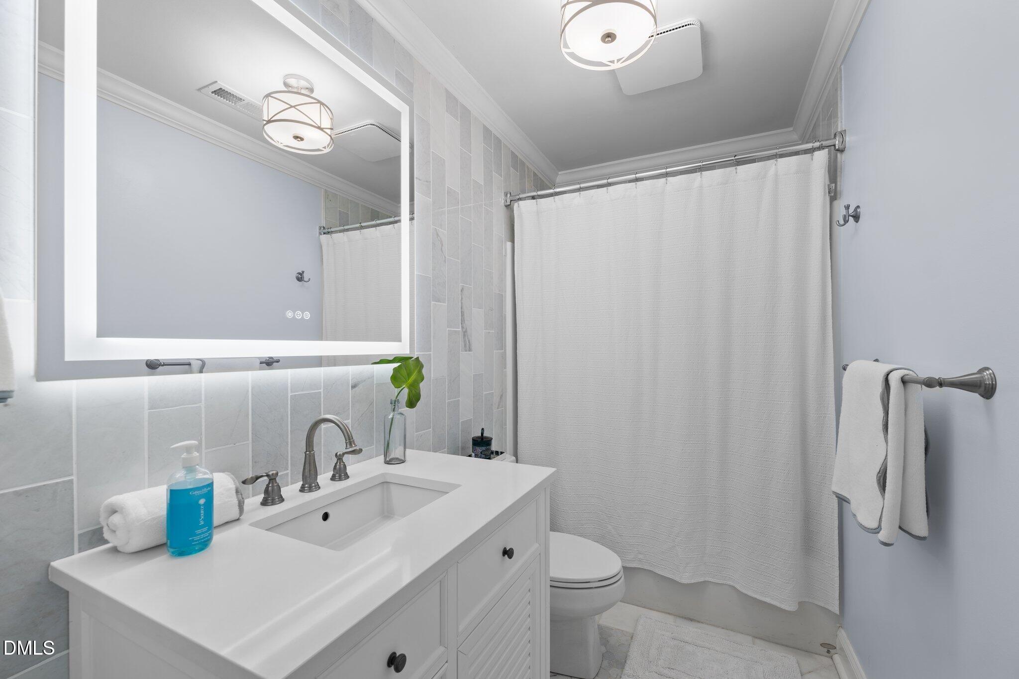 220 Epps Clark Road Siler City, NC 27344 - Photo 45 of 55 a bathroom with a sink toilet and shower