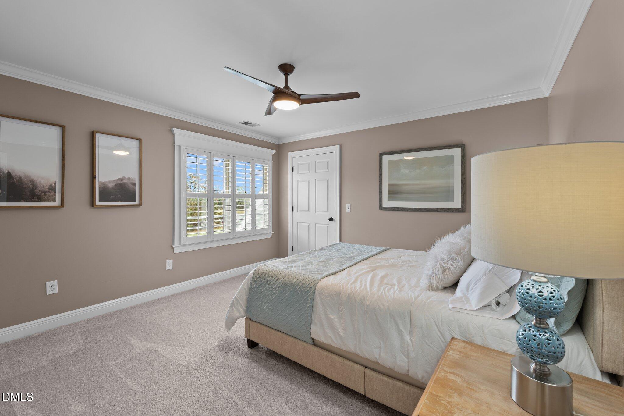 220 Epps Clark Road Siler City, NC 27344 - Photo 46 of 55 a bedroom with a large bed and a window