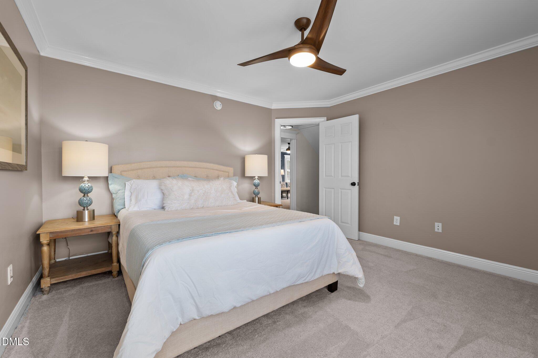 220 Epps Clark Road Siler City, NC 27344 - Photo 47 of 55 a bedroom with a bed and a lamp