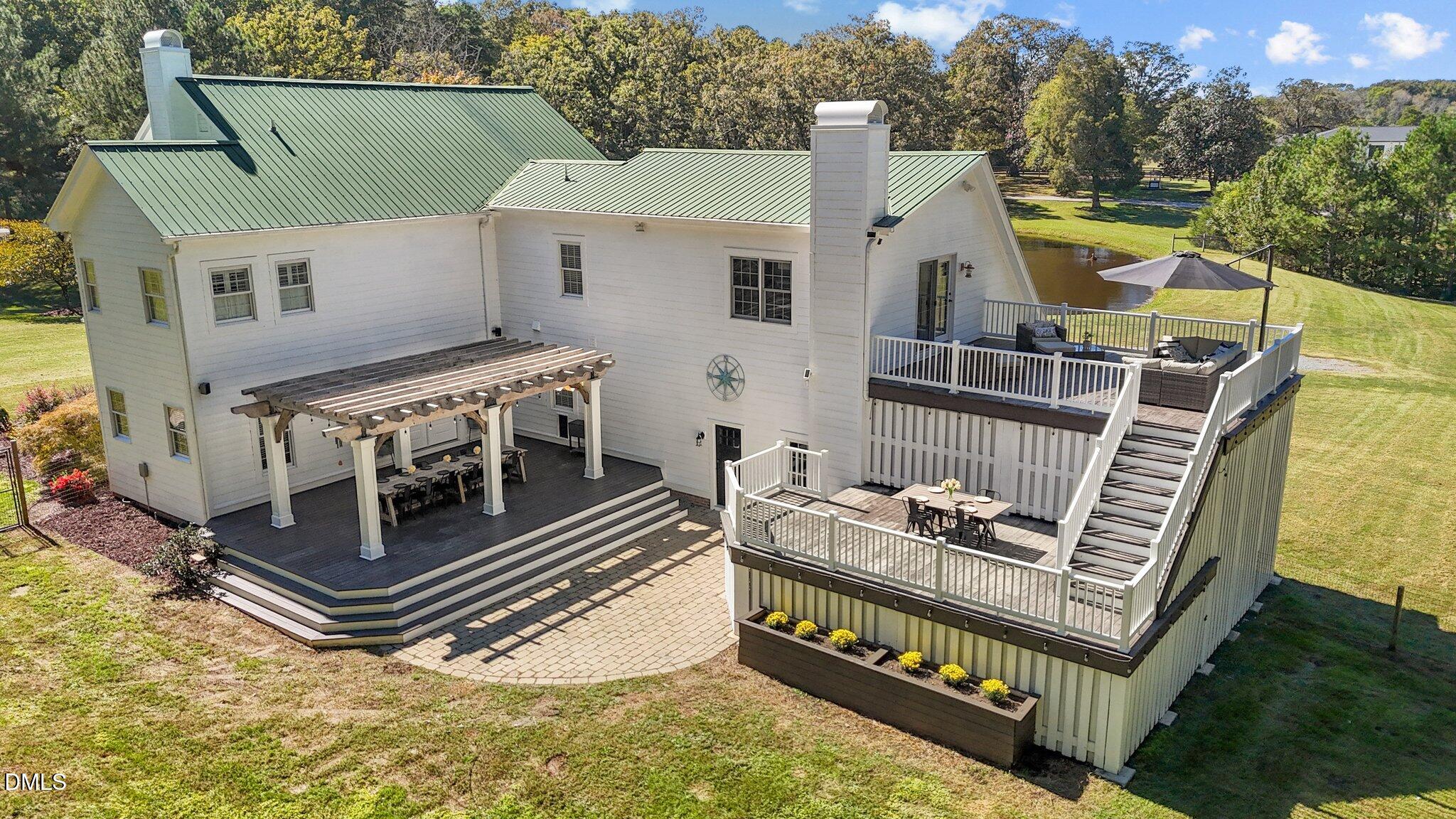 220 Epps Clark Road Siler City, NC 27344 - Photo 6 of 55 an aerial view of a house with balcony and deck with furniture