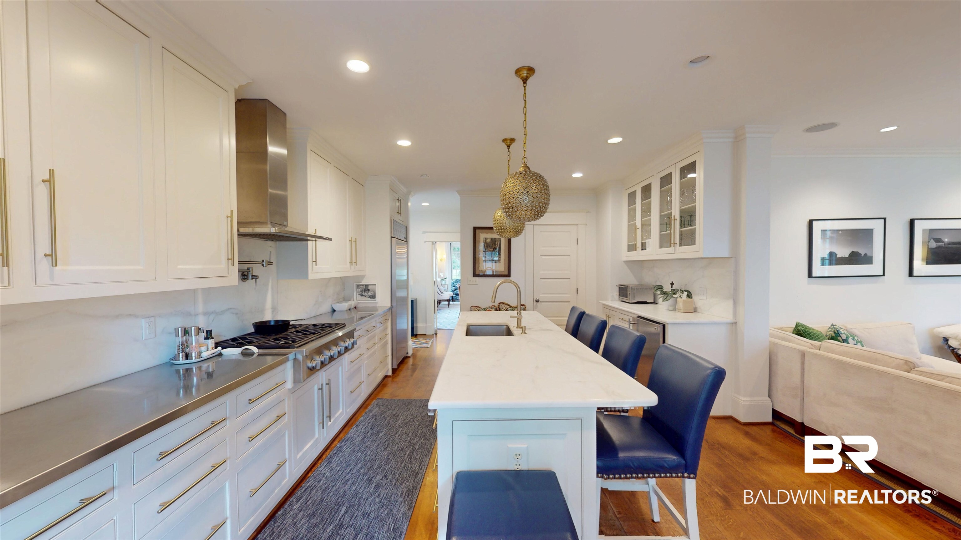211 Lanier Avenue Mobile, AL 36607 - Photo 19 of 73 Kitchen featuring wood finished floors, white cabinets, glass insert cabinets, a kitchen bar, and recessed lighting