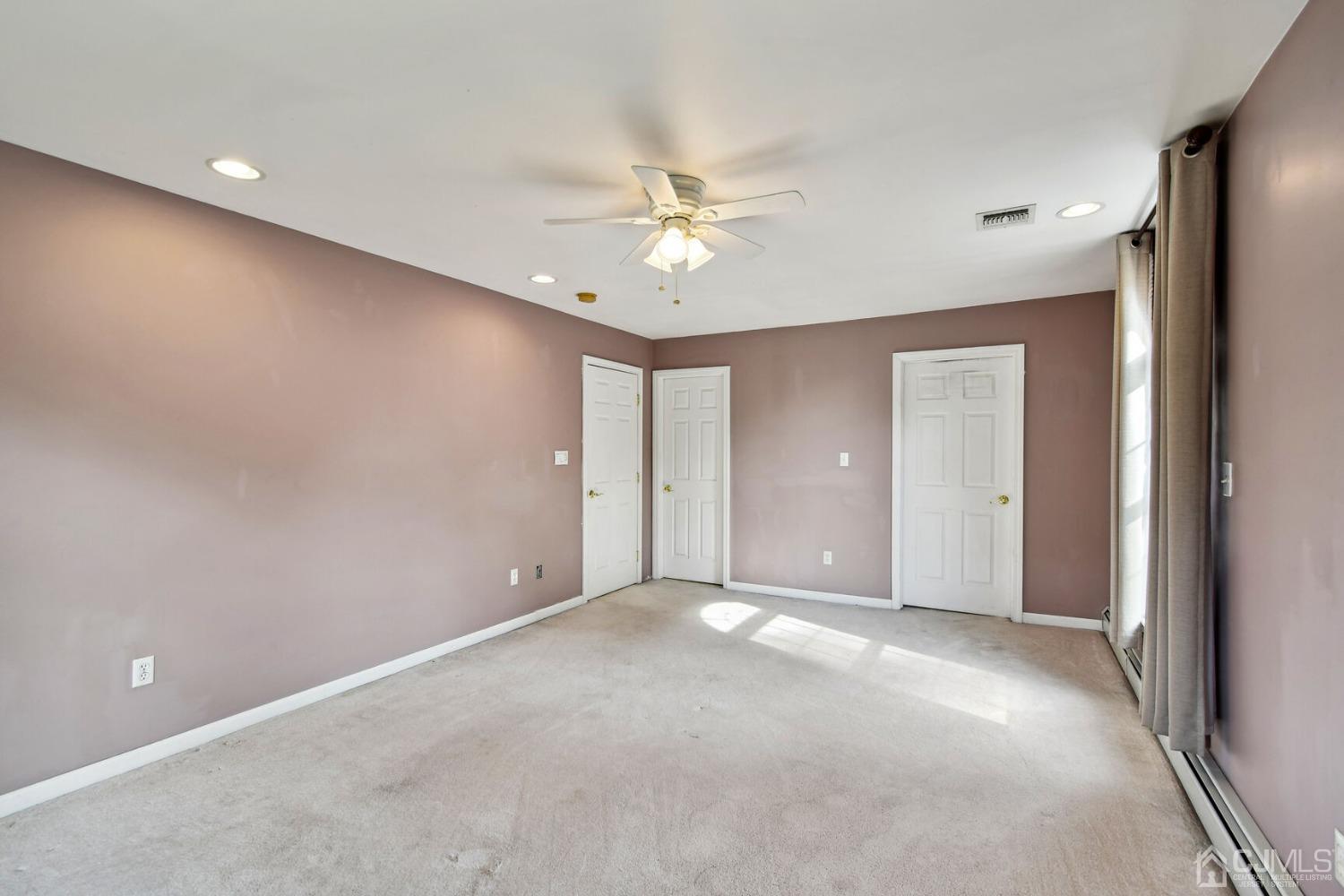 220 Dunhams Corner Road East Brunswick, NJ 08816 - Photo 15 of 27 an empty room with fan and entryway