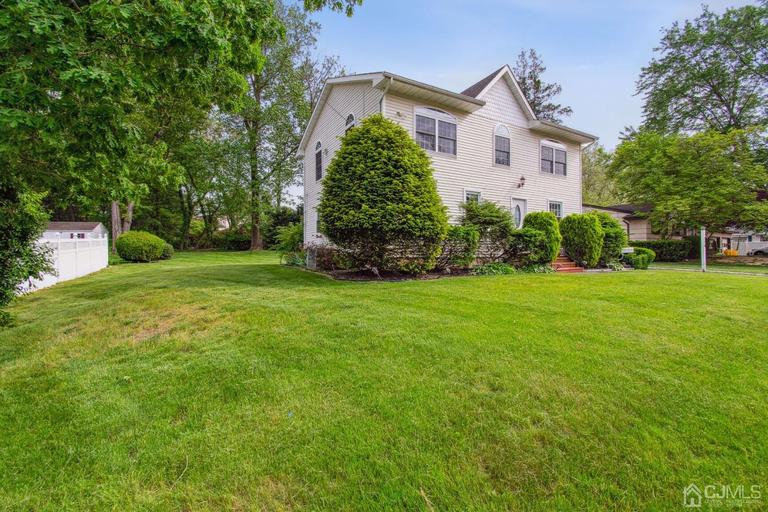 220 Dunhams Corner Road East Brunswick, NJ 08816 - Photo 2 of 27 a front view of a house with a yard