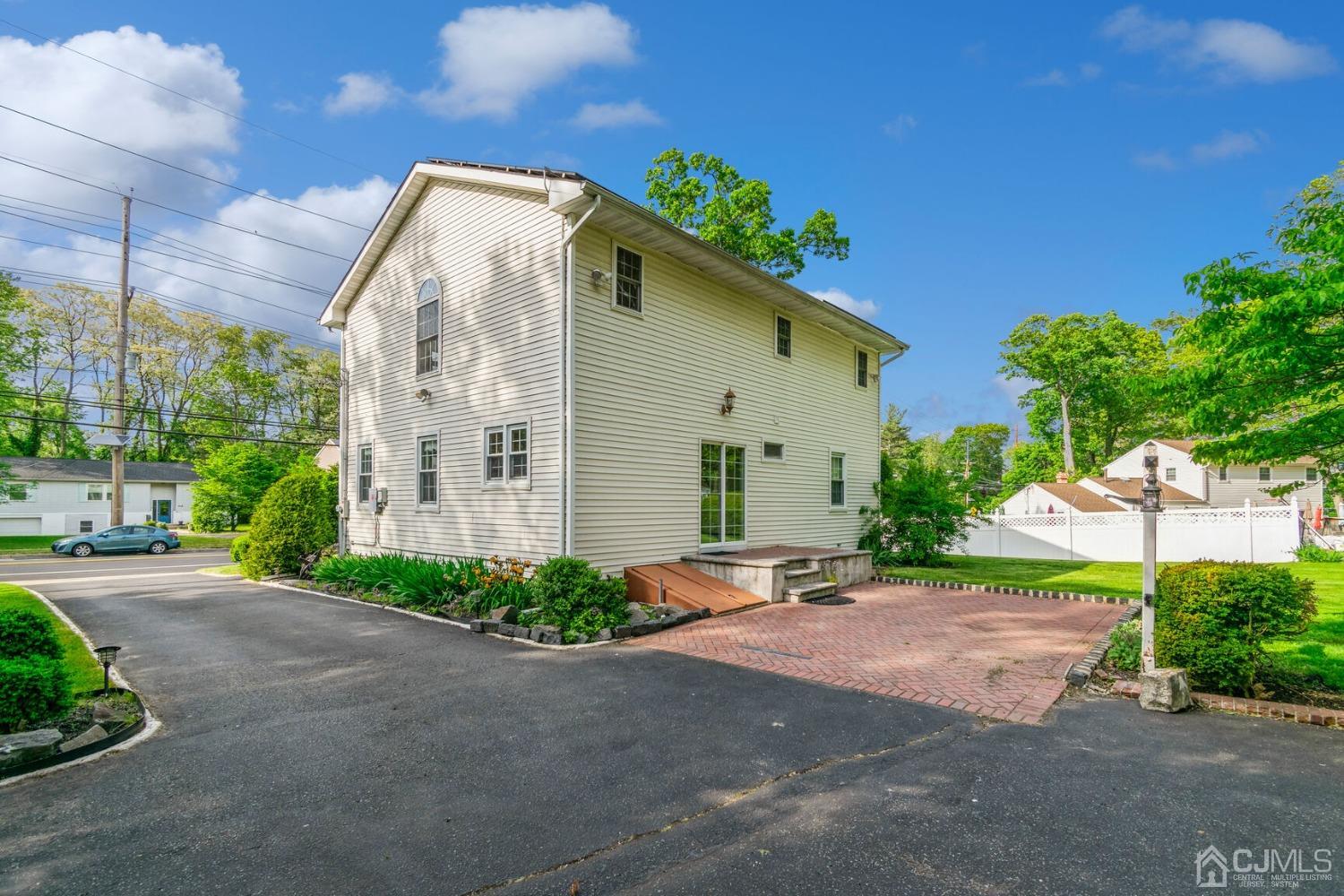 220 Dunhams Corner Road East Brunswick, NJ 08816 - Photo 24 of 27 a front view of a house with a yard and a garage