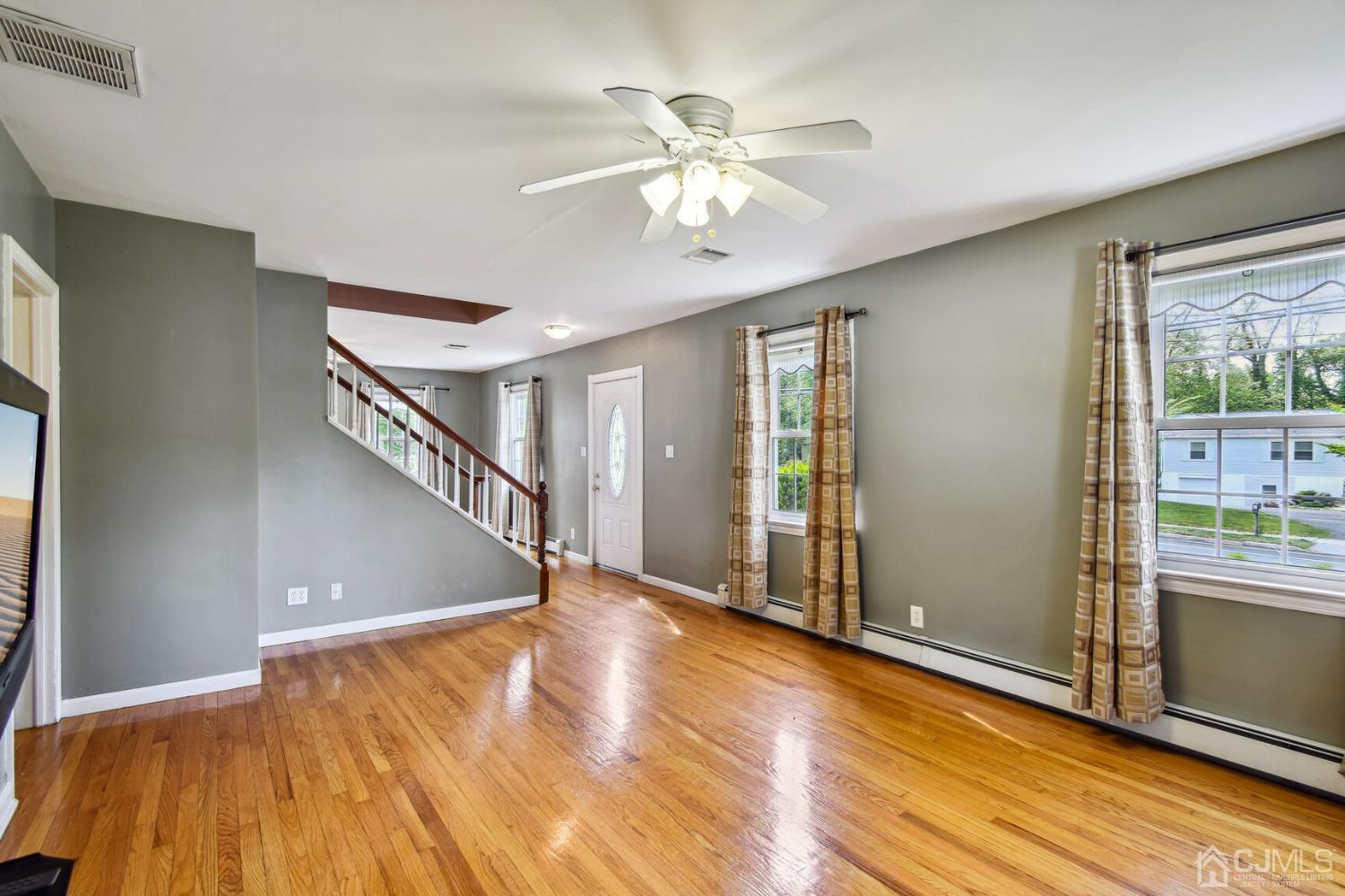 220 Dunhams Corner Road East Brunswick, NJ 08816 - Photo 7 of 27 a view of an entryway with wooden floor and a window