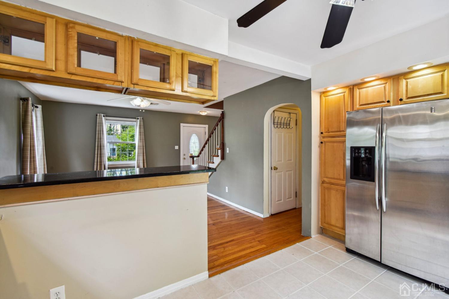 220 Dunhams Corner Road East Brunswick, NJ 08816 - Photo 9 of 27 a view of a living room with a refrigerator