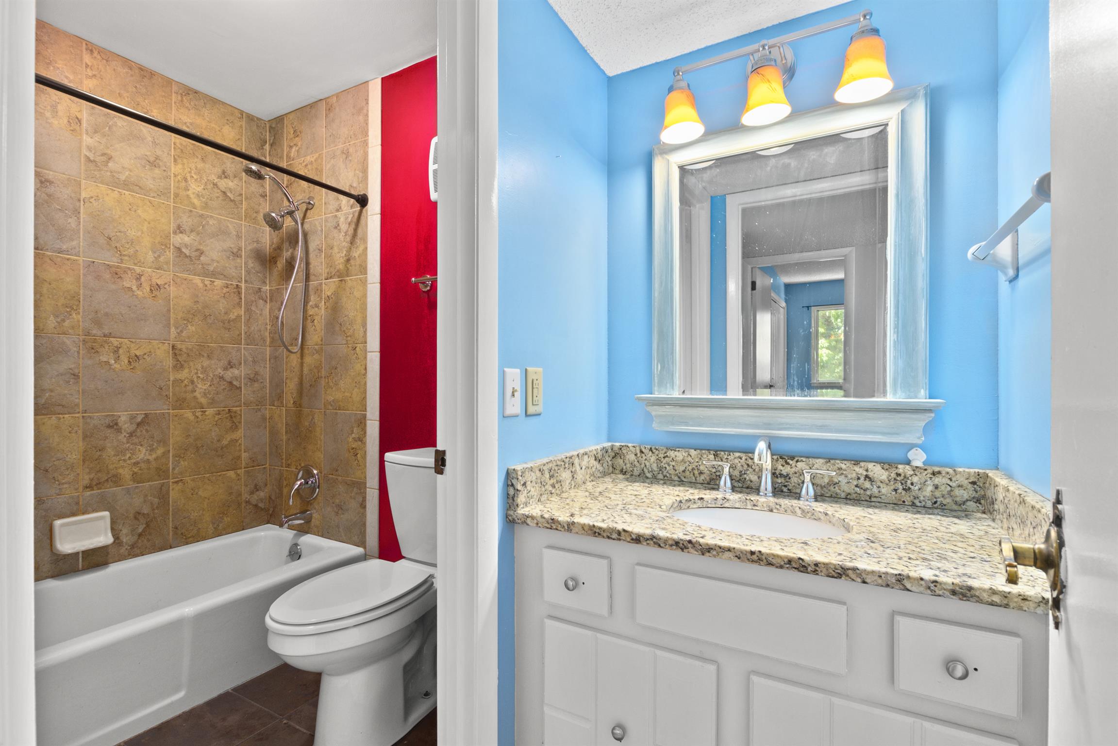 21 Vaughns Gap Road, Unit 23 Nashville, TN 37205 - Photo 13 of 16 a bathroom with a granite countertop sink a toilet and bathtub