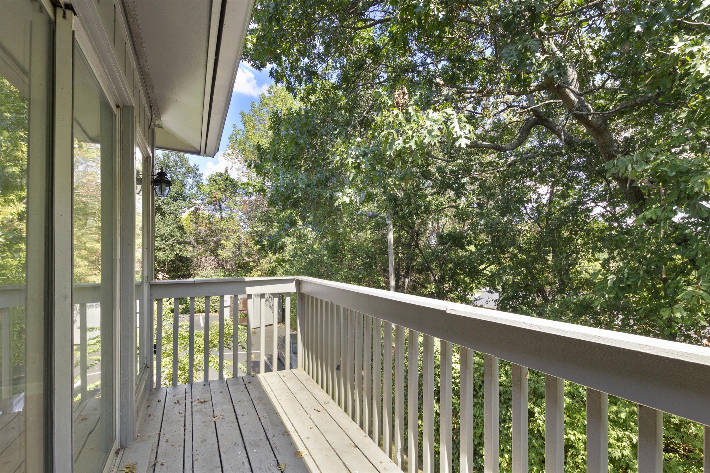 21 Vaughns Gap Road, Unit 23 Nashville, TN 37205 - Photo 15 of 16 a view of balcony with wooden floor