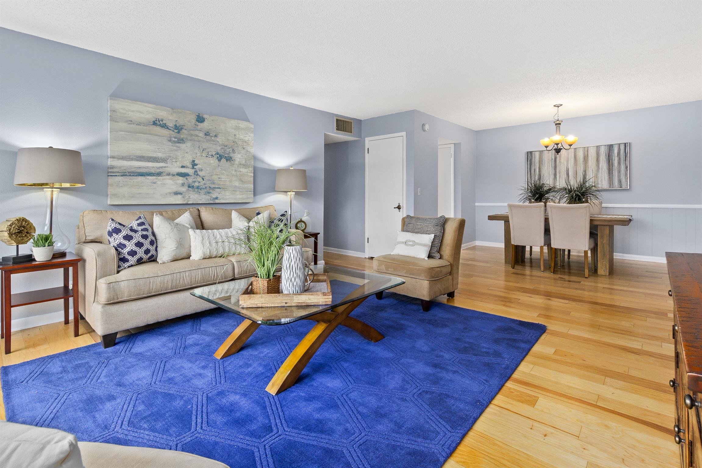 21 Vaughns Gap Road, Unit 23 Nashville, TN 37205 - Photo 5 of 16 a living room with furniture and wooden floor