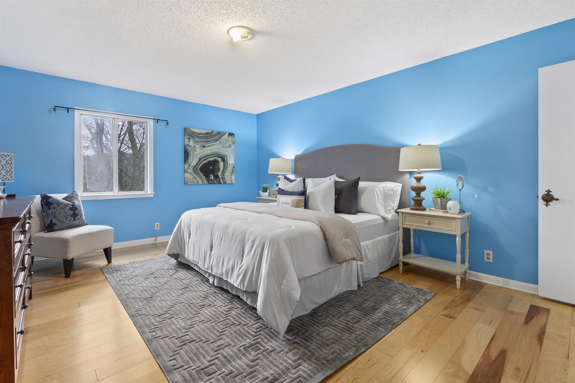 21 Vaughns Gap Road, Unit 23 Nashville, TN 37205 - Photo 9 of 16 a spacious bedroom with a bed and a couch