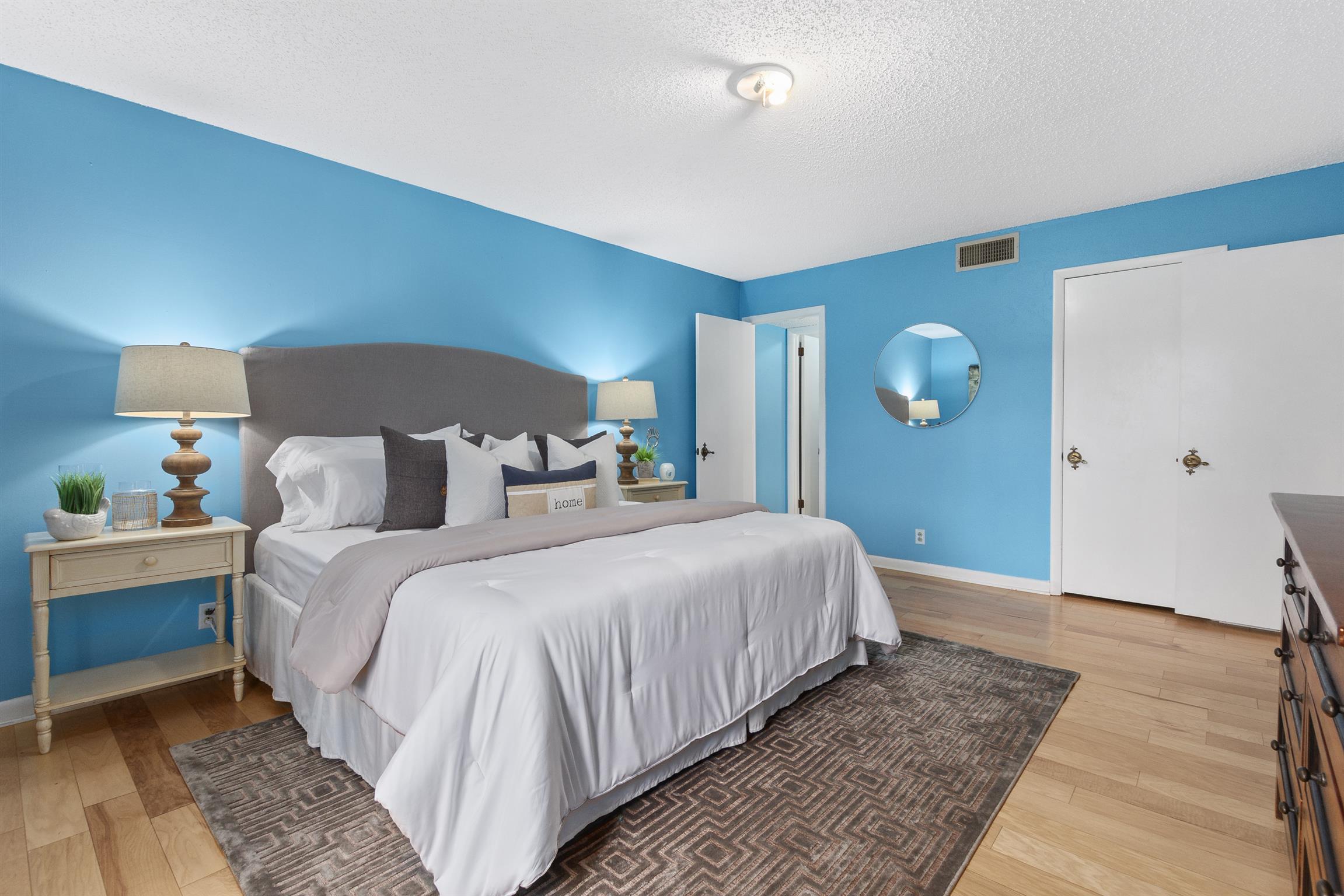 21 Vaughns Gap Road, Unit 23 Nashville, TN 37205 - Photo 10 of 16 a bedroom with bed and wooden floor