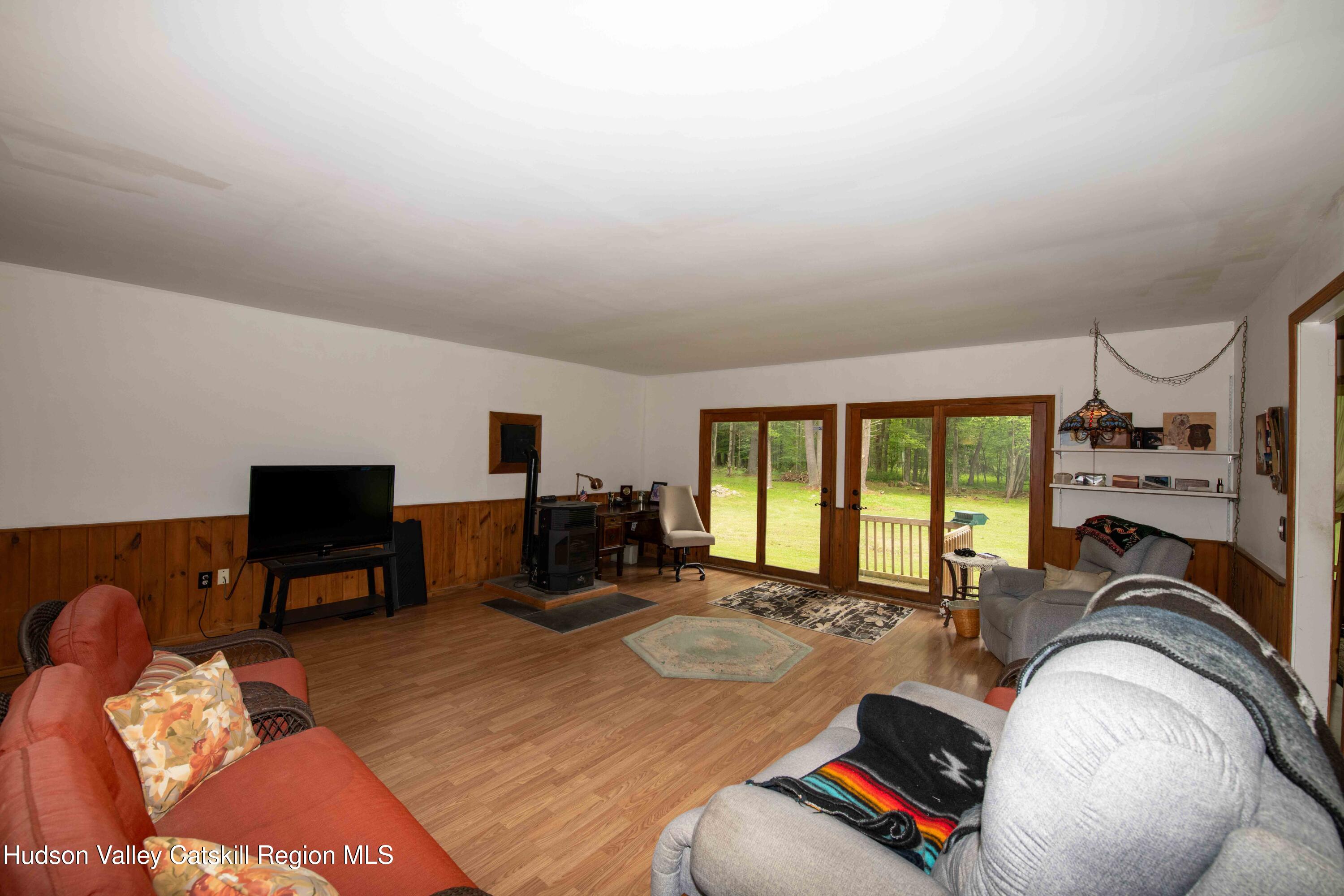 22 Elm Lane Greenville, NY 12083 - Photo 14 of 19 a bed room with a bed and a couch