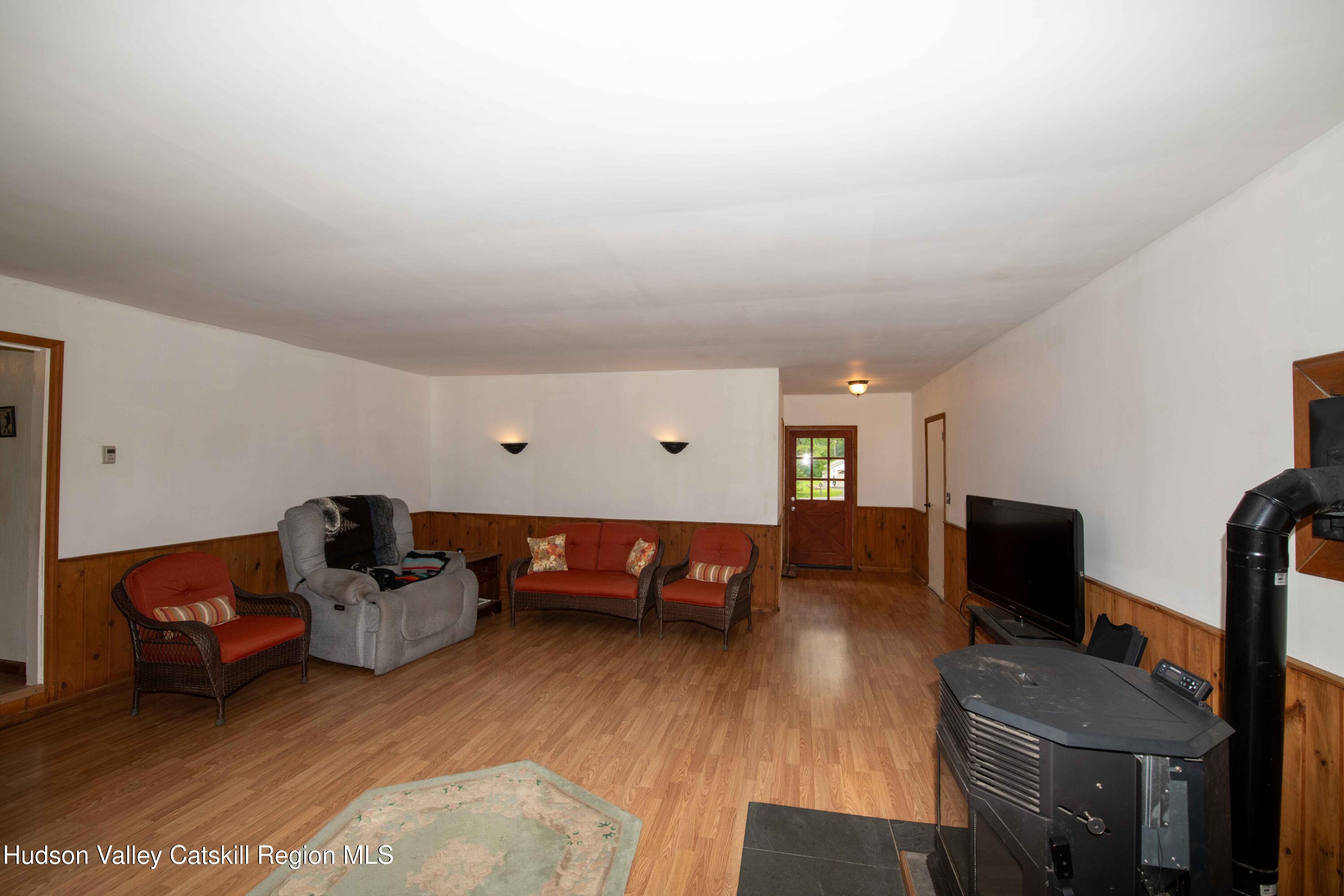22 Elm Lane Greenville, NY 12083 - Photo 15 of 19 a living room with furniture and a flat screen tv