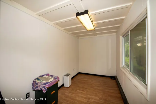 a view of workspace with wooden floor