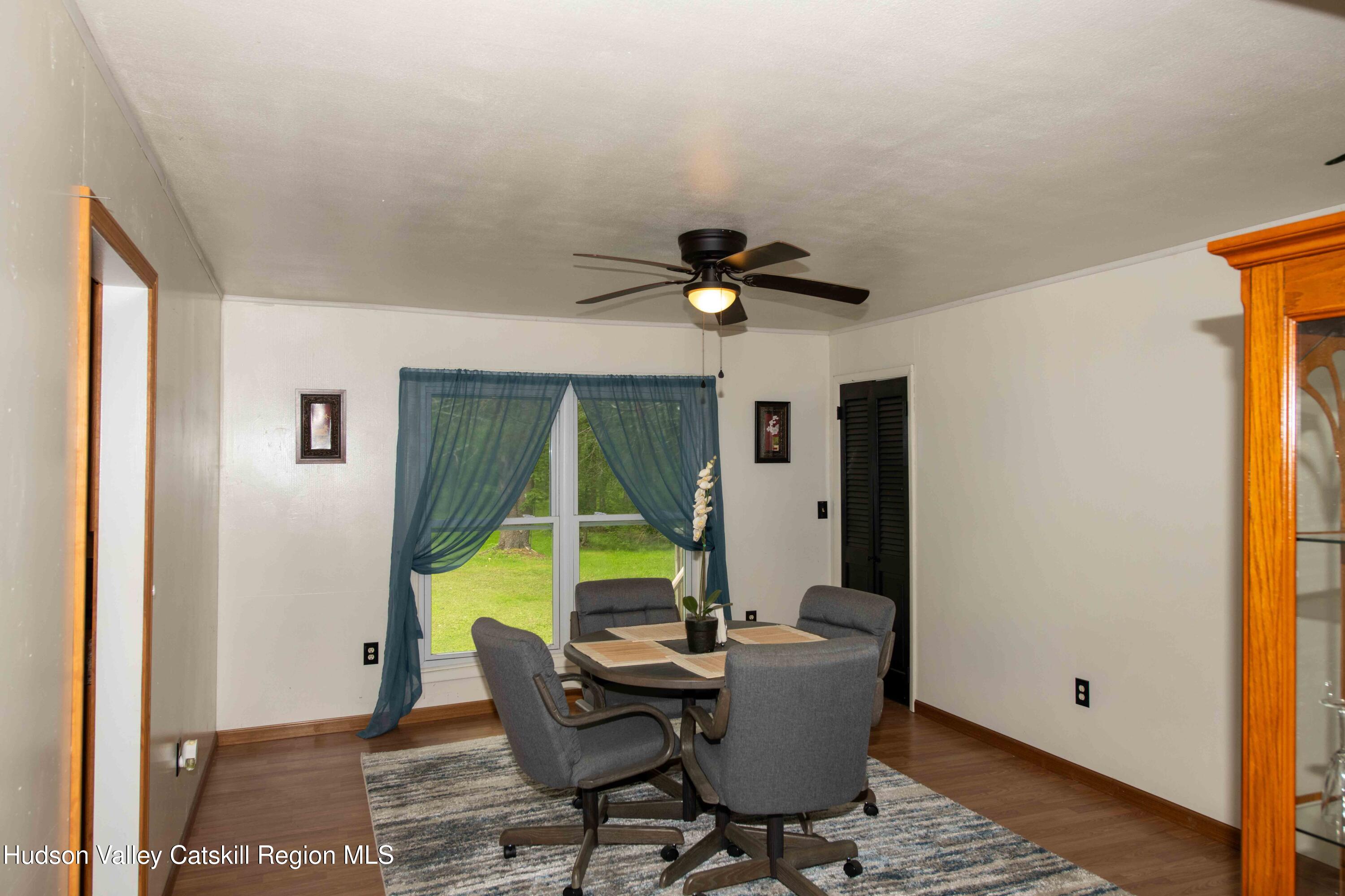 22 Elm Lane Greenville, NY 12083 - Photo 6 of 19 a view of a dining room with furniture and a window