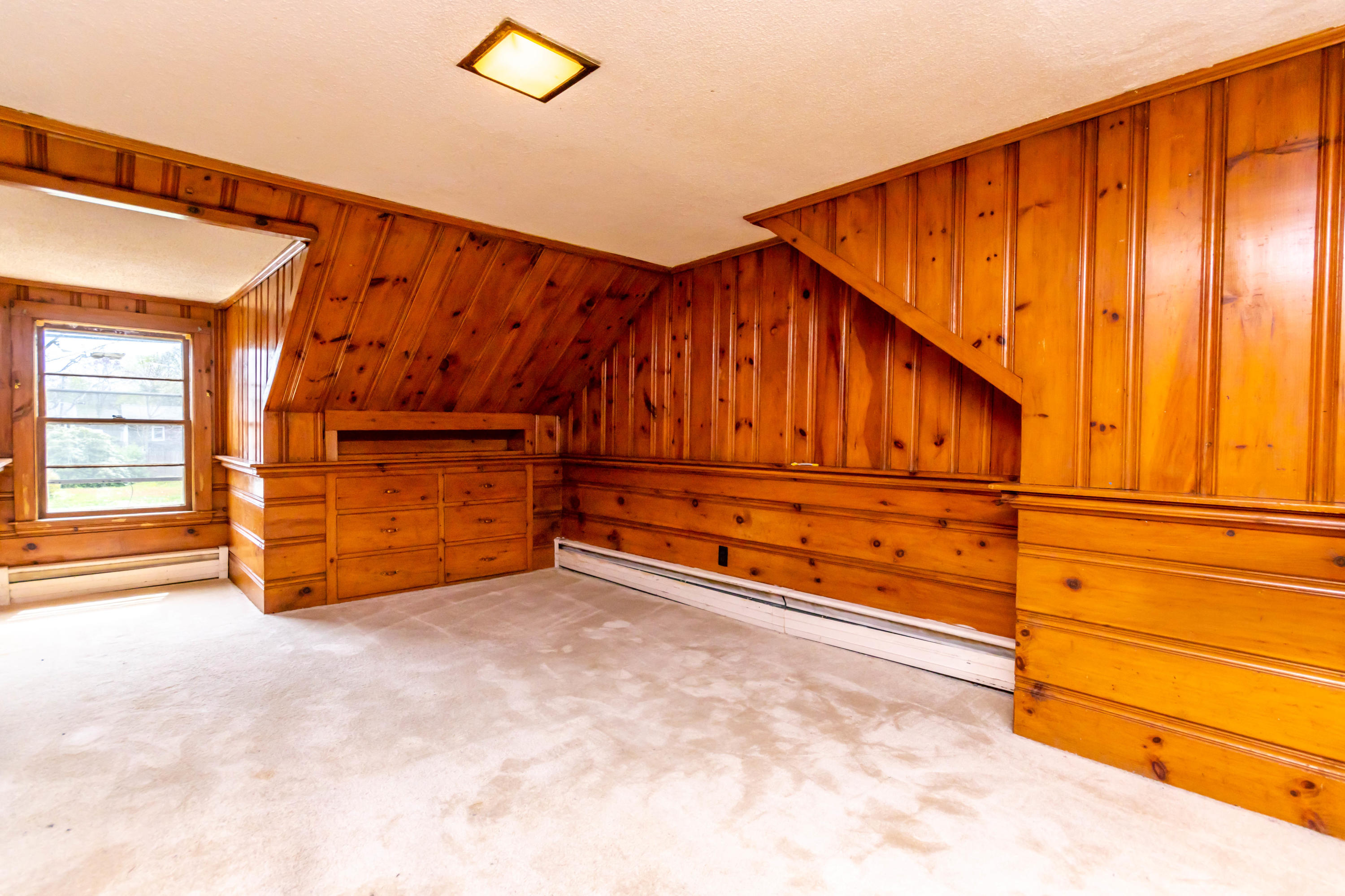 57 Puritan Road Buzzards Bay, MA 02532 - Photo 23 of 27 an empty room with wooden floor and windows