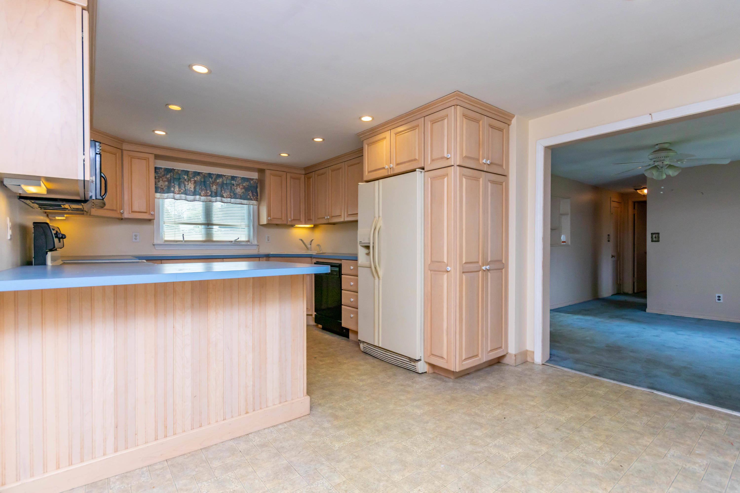 57 Puritan Road Buzzards Bay, MA 02532 - Photo 3 of 27 a kitchen with stainless steel appliances granite countertop a refrigerator and a sink